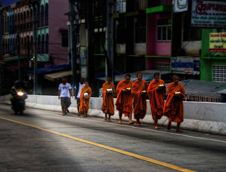 Thai monks walking through the CBD